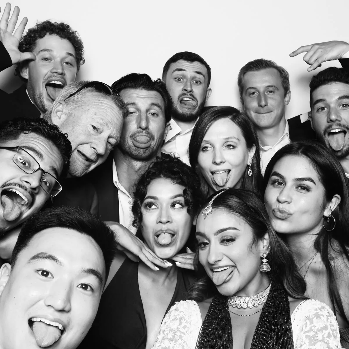 Guests using Clutch City glam photo booth at Houston party